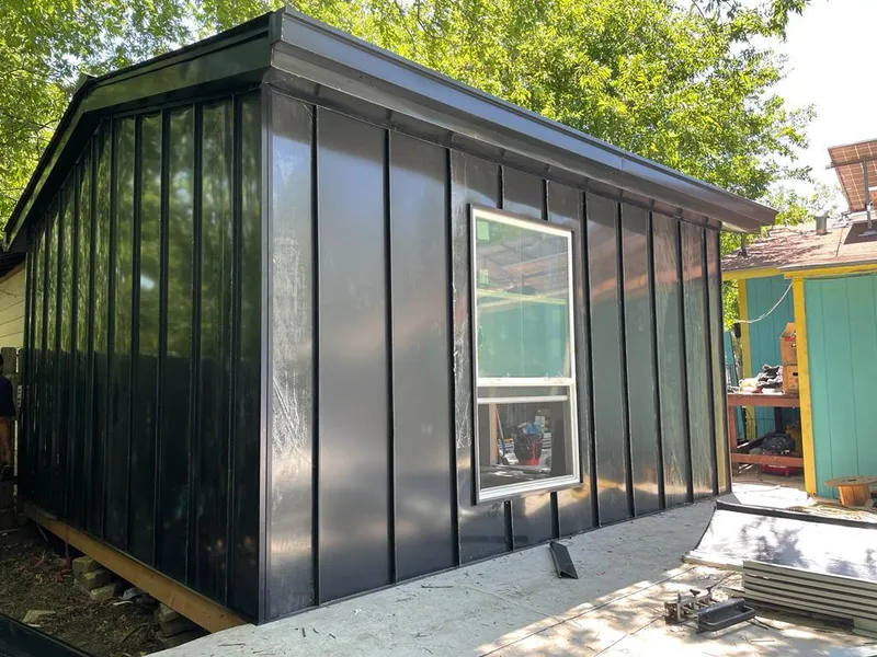 Black standing seam metal wall panels for Roof Inspection in Seguin