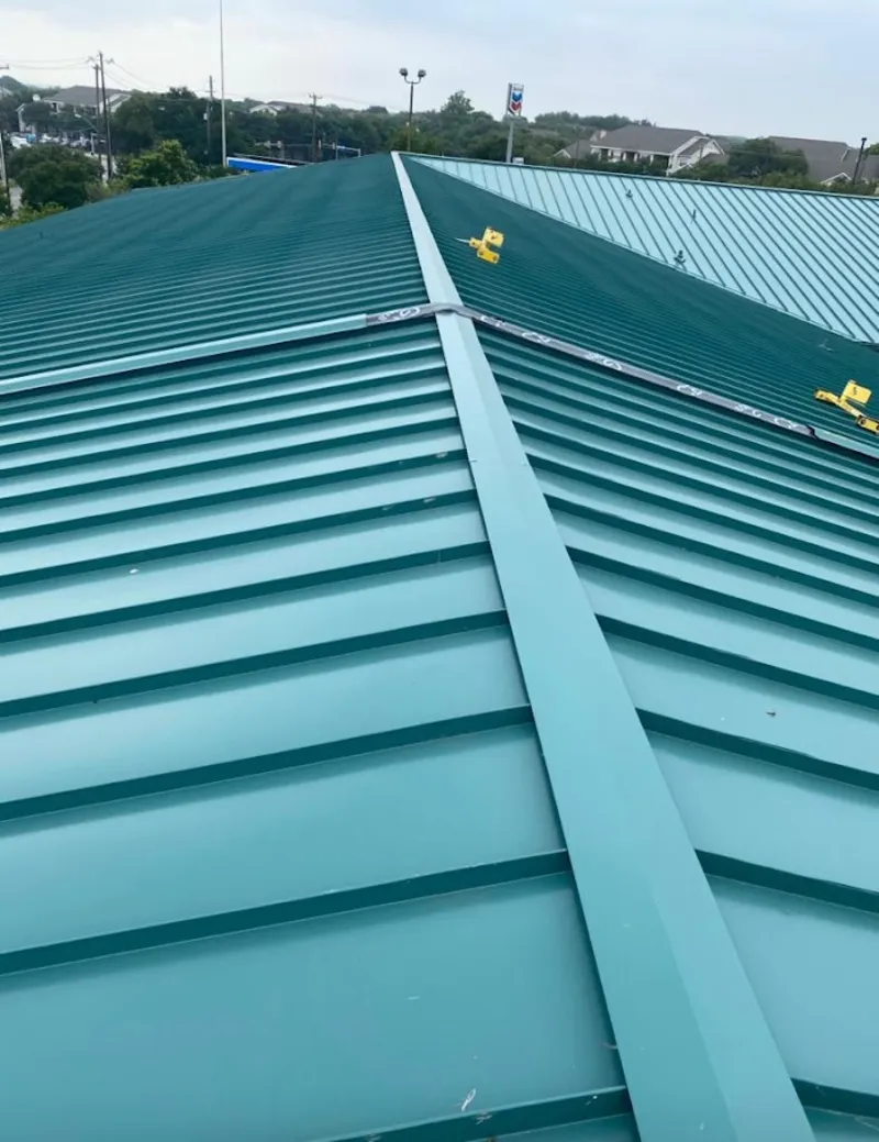 Green commercial metal roof ridge and valley for Metal Roof Repair in Seguin