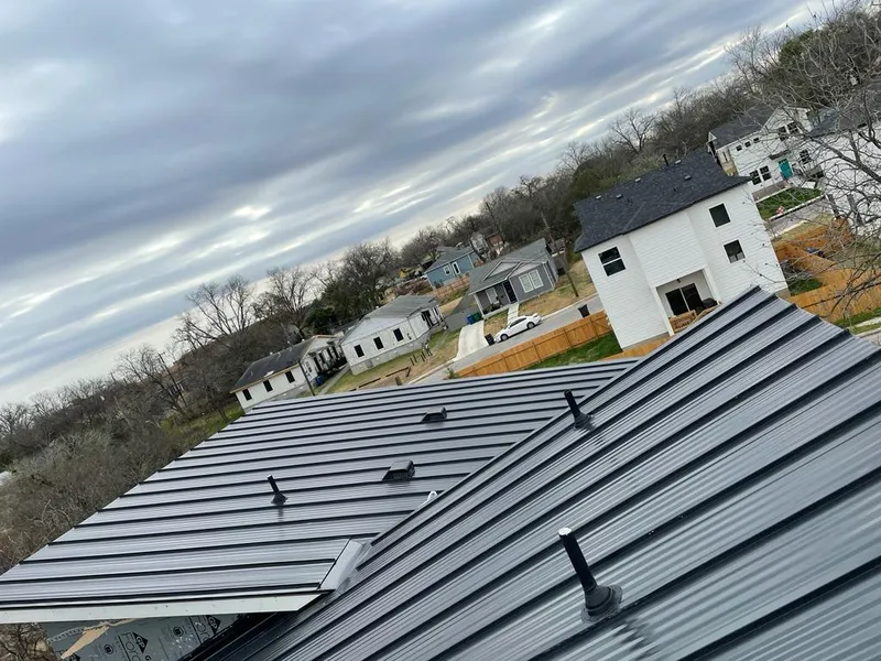 Standing seam metal roof panels with vents for Skylight Repair in Seguin